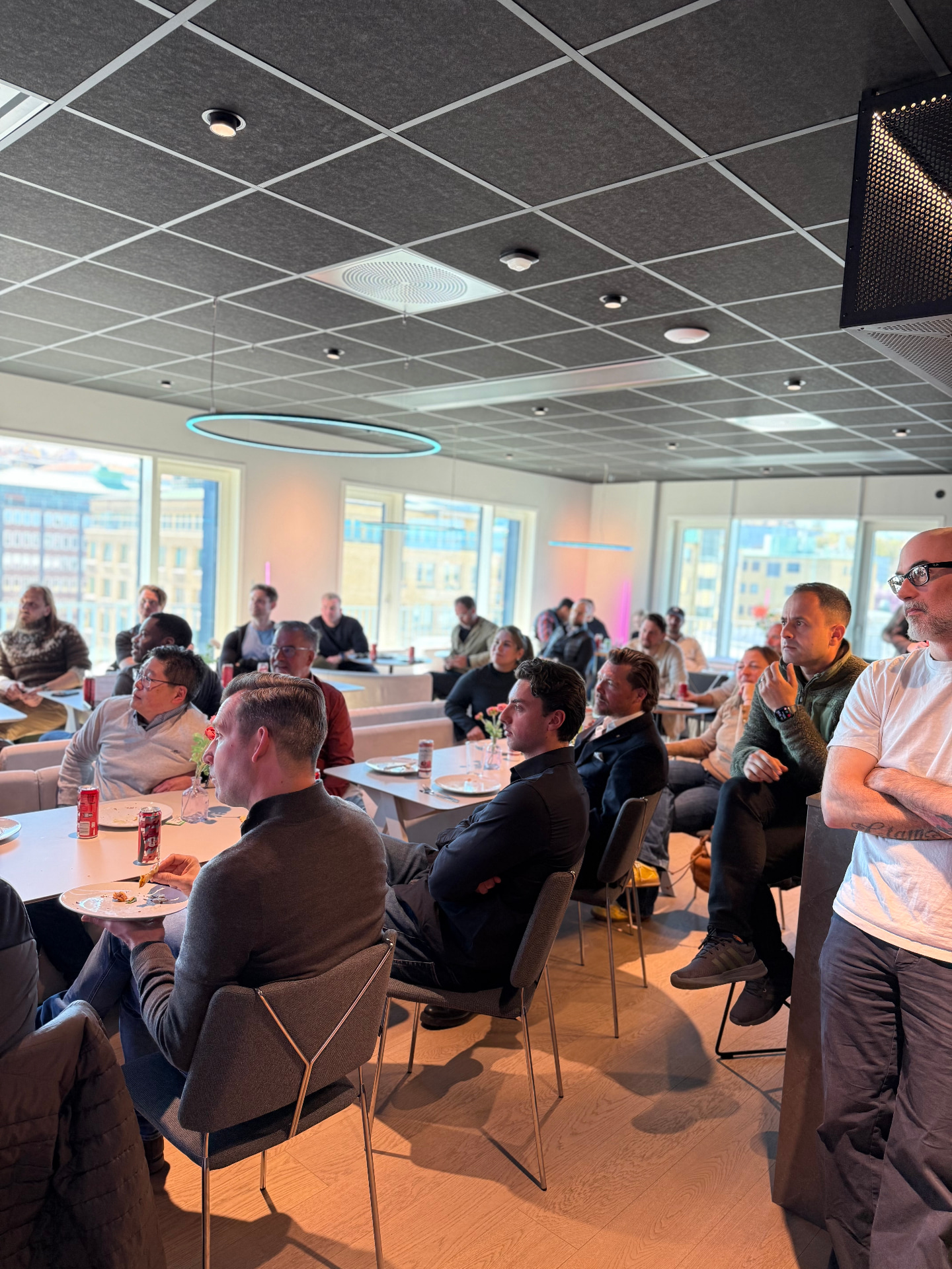 The audience leaning in during the Q&A session after the demos